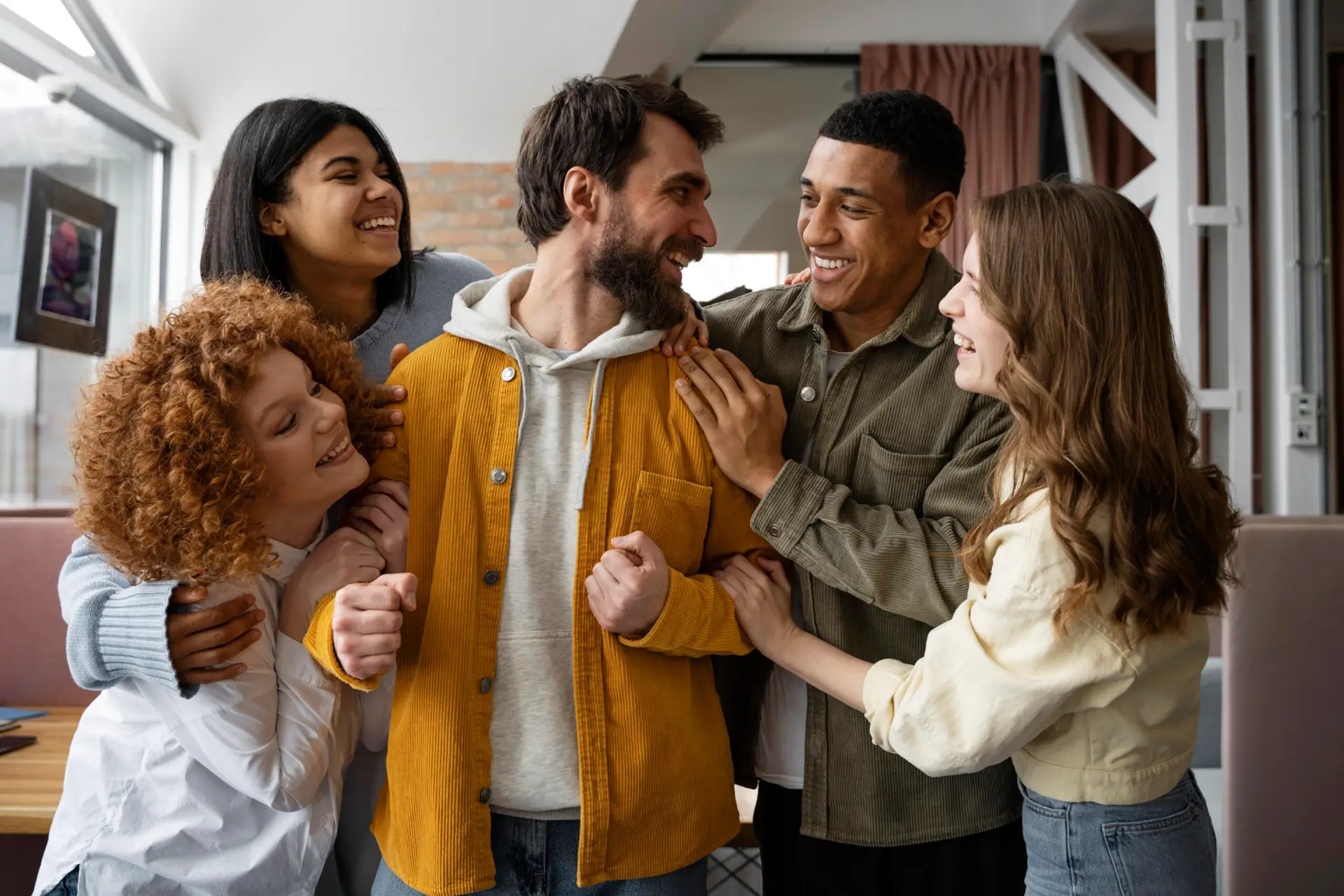 photo of a small group of people engaging in conversation